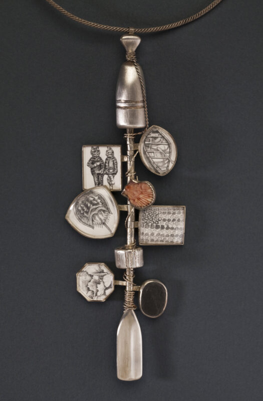 photo of a many layered silver pendant with a set found object and illustrations entitled Cape Code Remembered by metal artist Lynda Watson