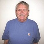 portrait of artist instructor Bob Rush wearing a blue shirt