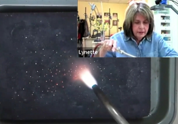 Lynette Cederquist creates granules of Argentium on a charcoal block